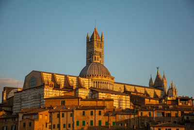 Low angle view of building against clear blue sky