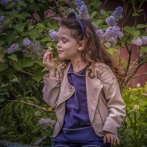 Young woman looking at flowering plants