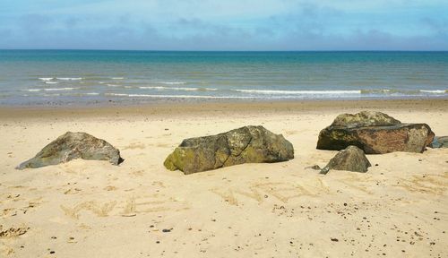 View of calm beach against the sky