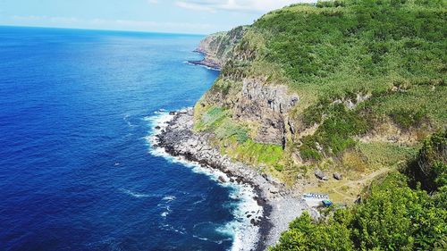 High angle view of sea shore against sky