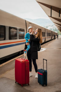 Woman on railroad station platform