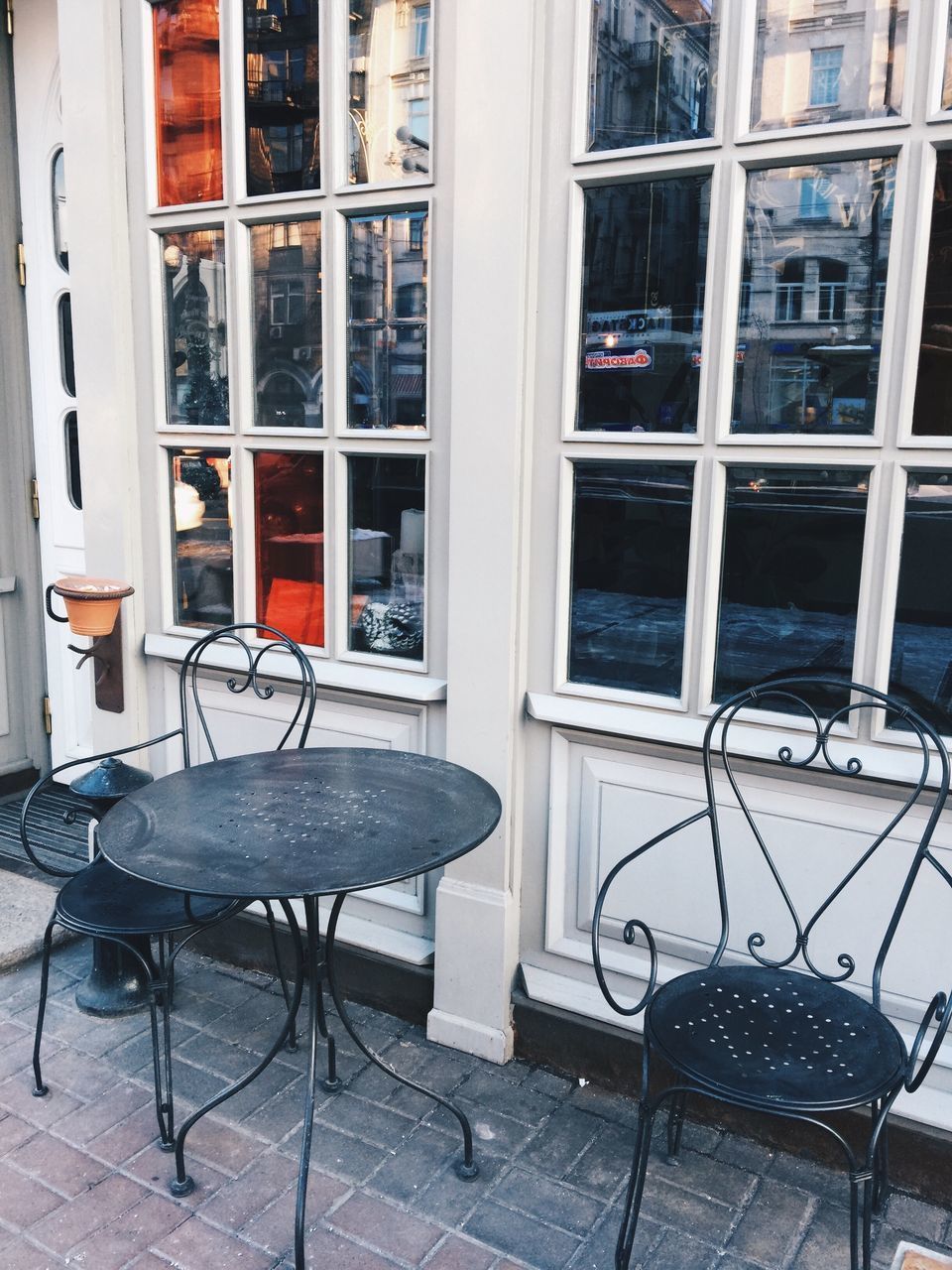 EMPTY CHAIRS AND TABLES IN BUILDING