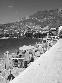 Rear view of a sitting overlooking calm sea