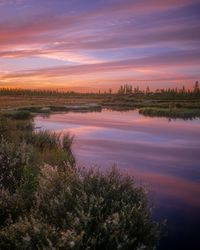 Scenic view of lake against sky during sunset