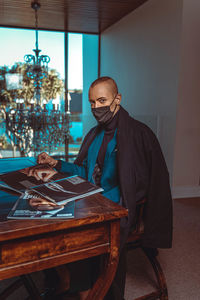 Man wearing mask on table