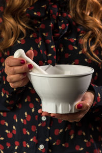 Close-up of woman holding drink