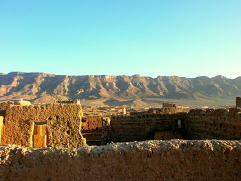 Scenic view of mountains against clear blue sky