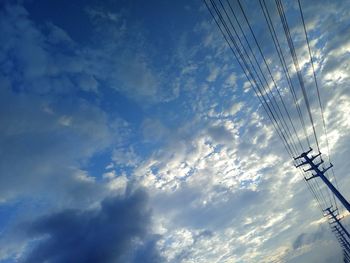 Low angle view of cables against sky