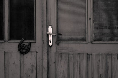 Closed wooden door of old house