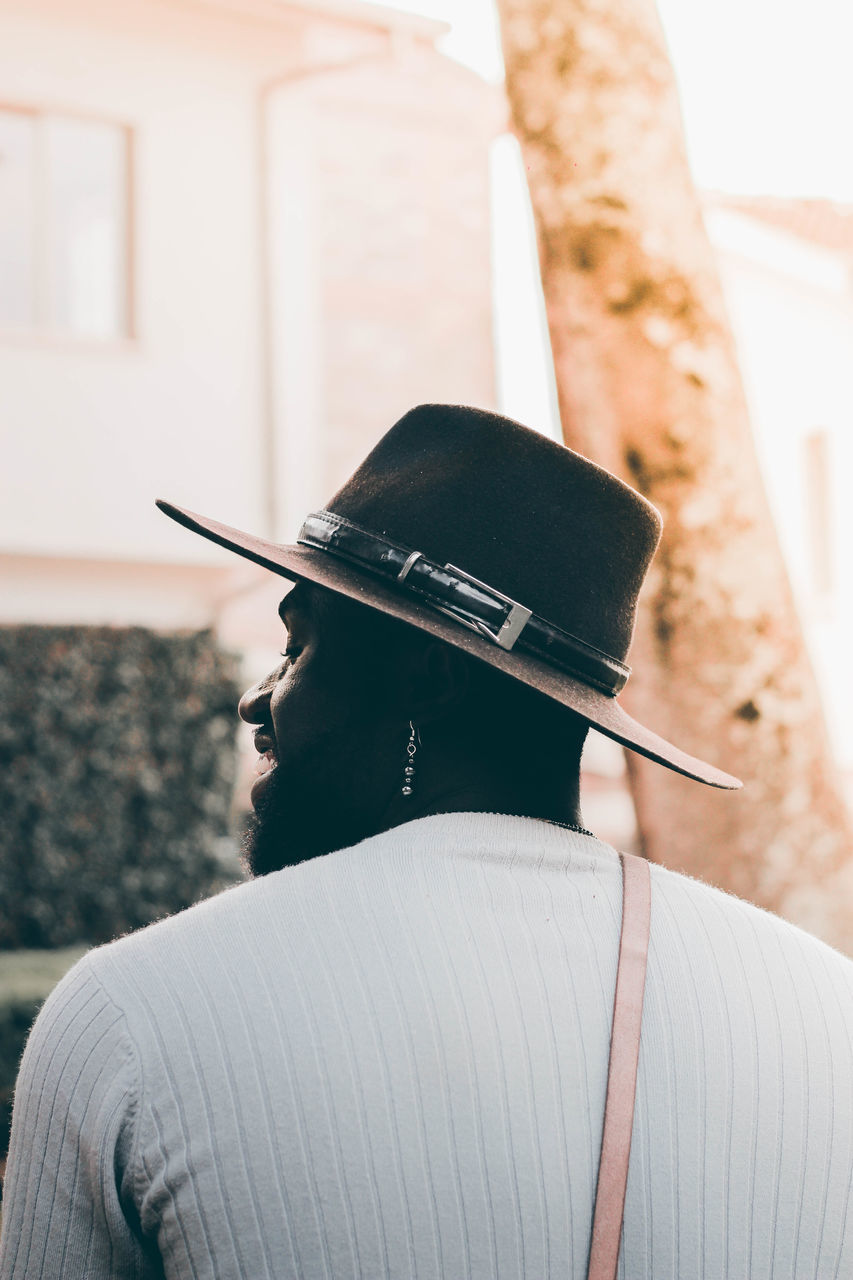 REAR VIEW PORTRAIT OF WOMAN WITH HAT