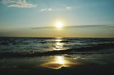 Scenic view of sea against sky at sunset