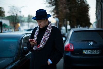 Man standing in car