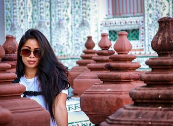 Portrait of woman wearing sunglasses outdoors