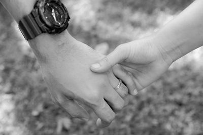 Close-up of man holding hands