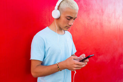 Midsection of man using mobile phone