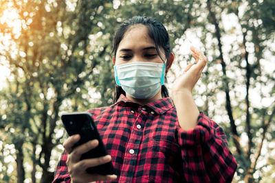 Young woman using mobile phone