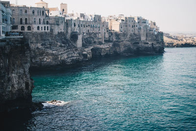 View of sea with buildings in background