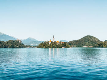 Scenic view of lake bled against sky