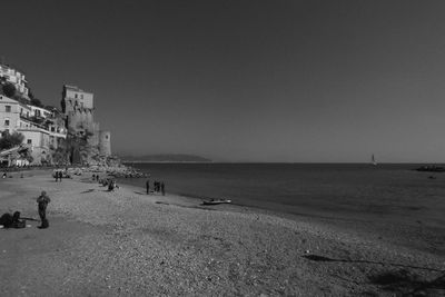 Scenic view of beach against clear sky