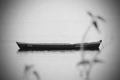 Boat on sea against blurred background