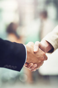 Close-up of business people shaking hands