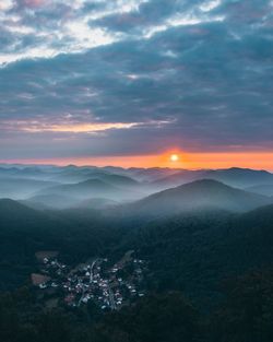 Scenic view of mountains against sky during sunset