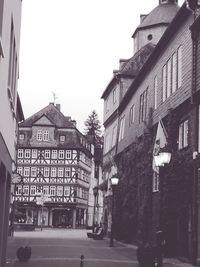 Cars on road against buildings