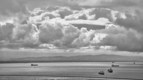 Scenic view of sea against cloudy sky