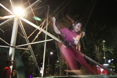 Low angle view of woman at music concert