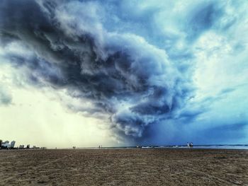 Scenic view of dramatic sky over land