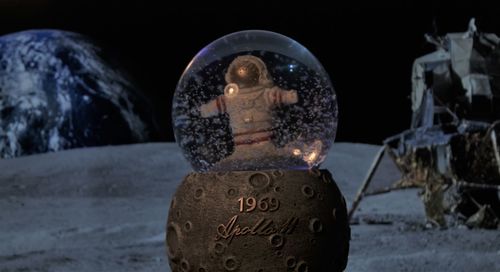 Close-up of illuminated text on snow covered land