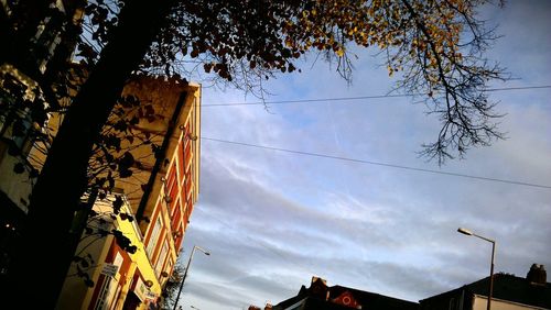 Low angle view of building against cloudy sky