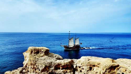 Scenic view of sea against blue sky