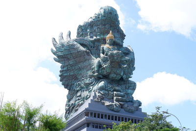 Low angle view of statue against sky