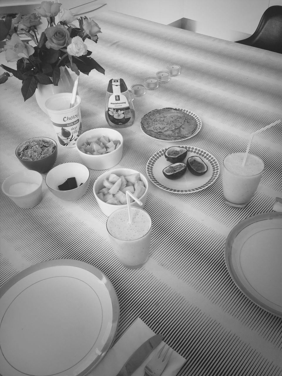 indoors, table, high angle view, still life, chair, empty, arrangement, plate, no people, place setting, large group of objects, absence, in a row, drink, food and drink, home interior, container, close-up, pattern, tablecloth