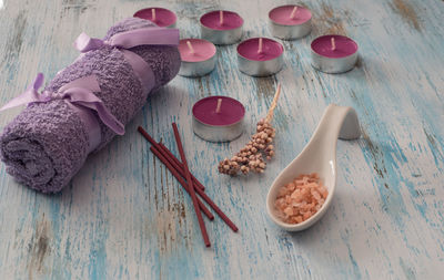 High angle view of spa treatment items on wooden table