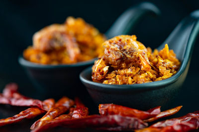 Close-up of meat in cooking pan on table