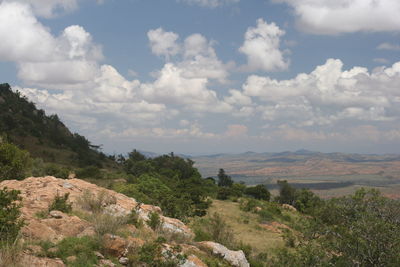 Scenic view of landscape against cloudy sky