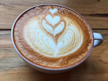 Close-up of cappuccino on table