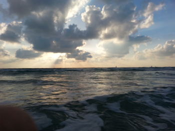 Scenic view of sea against cloudy sky