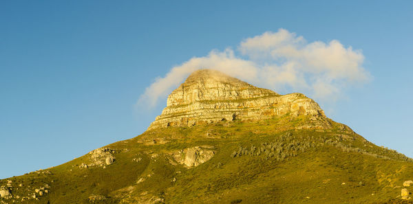 Low angle view of rock formations against sky