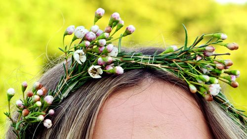 Close-up of woman with flowers