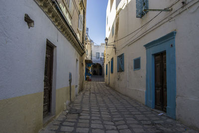 People walking on cobblestone street