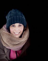 Portrait of smiling woman in snow