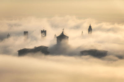 Low angle view of lighthouse against sky during sunset