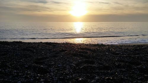 Scenic view of sea at sunset