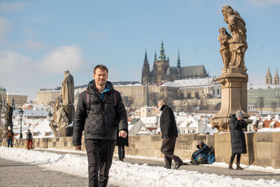 Group of people in front of buildings