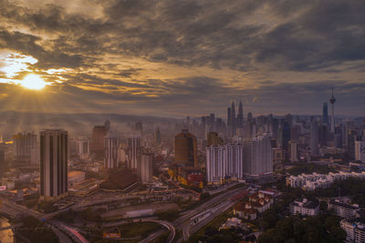 High angle view of buildings against sky during sunset