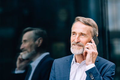 Portrait of man looking away outdoors