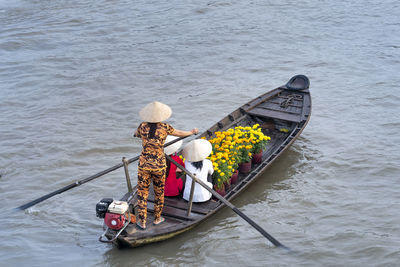 High angle view of people in boat on river